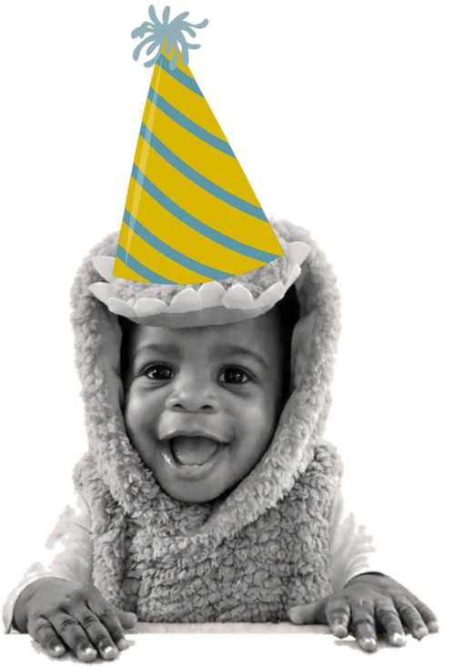 Max wearing a party hat